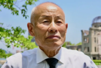 Toshiyuki Mimaki selamat dari pemboman Hiroshima pada 1945. Ia kini memimpin Nihon Hidankyo, organisasi penyintas bom atom Hiroshima-Nagasaki di Jepang. Ia menyebut, situasi di Gaza kini mirip di Jepang pada akhir masa perang dunia II.(BBC News/Tessa Wong)