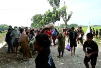 POV; Tradisi perang sego berkat di Desa Bogotanjung, Kecamatan Gabus Kabupaten Pati, Jawa Tengah. (Foto: detikJateng) 
